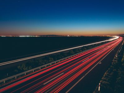 A beautiful view of transportation lights on the road at night time